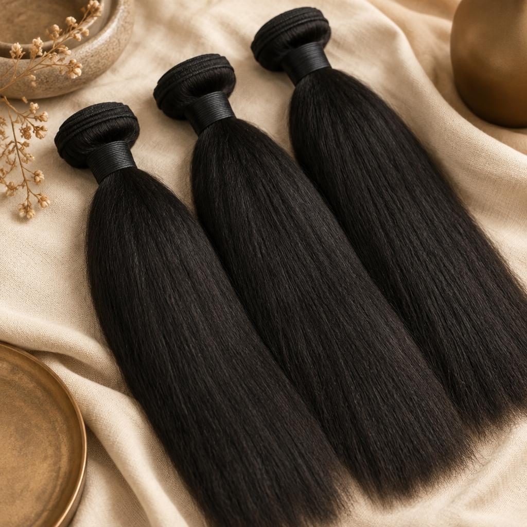 Bundles of yaki straight black human hair extensions with a light natural kink